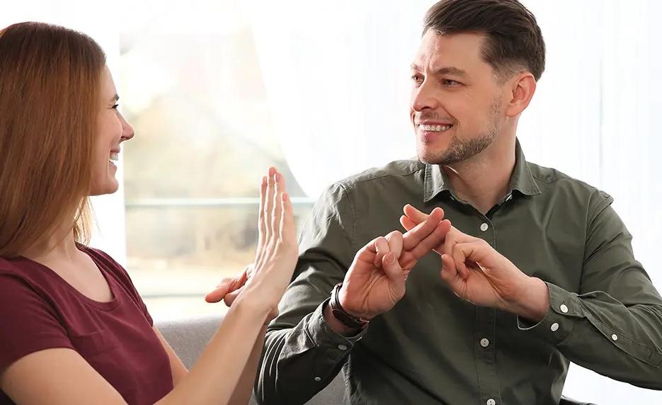 Man and woman using sign language